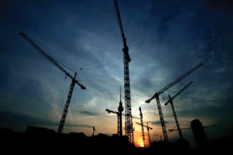 Cranes and lifting equipment agains the night sky